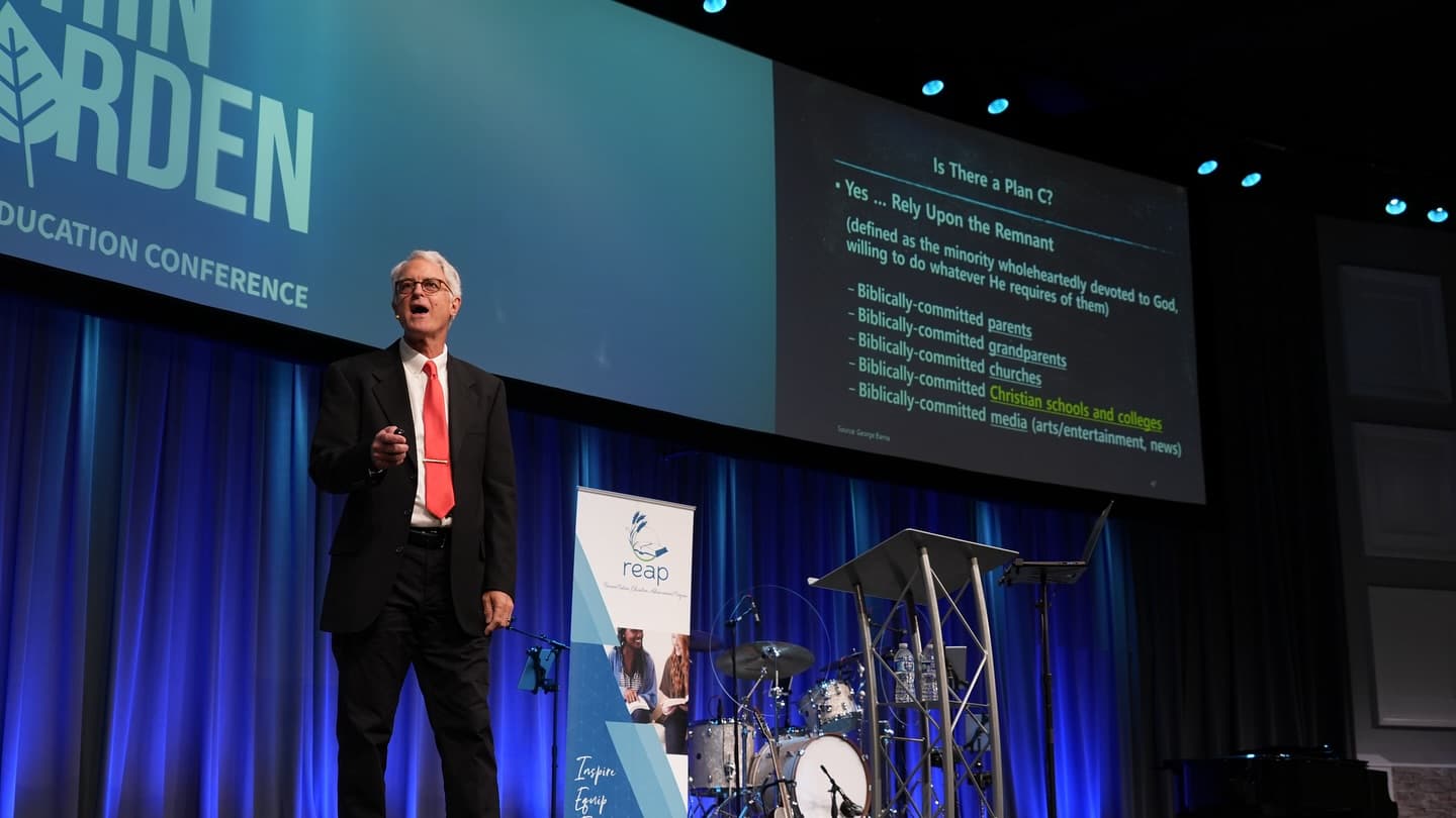 Keynote speaker on stage at a Christian education conference