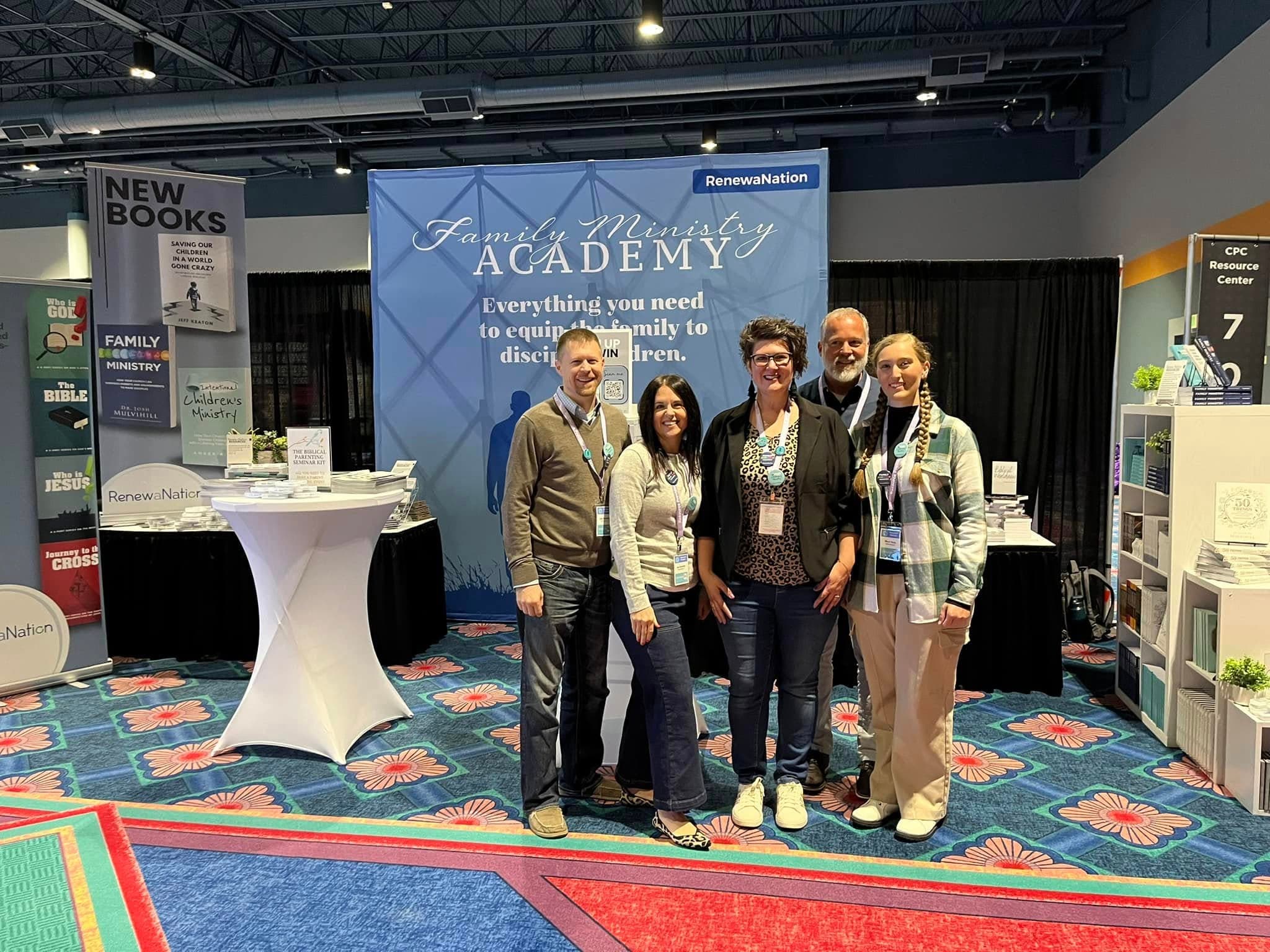Team at the Family Ministry Academy conference booth