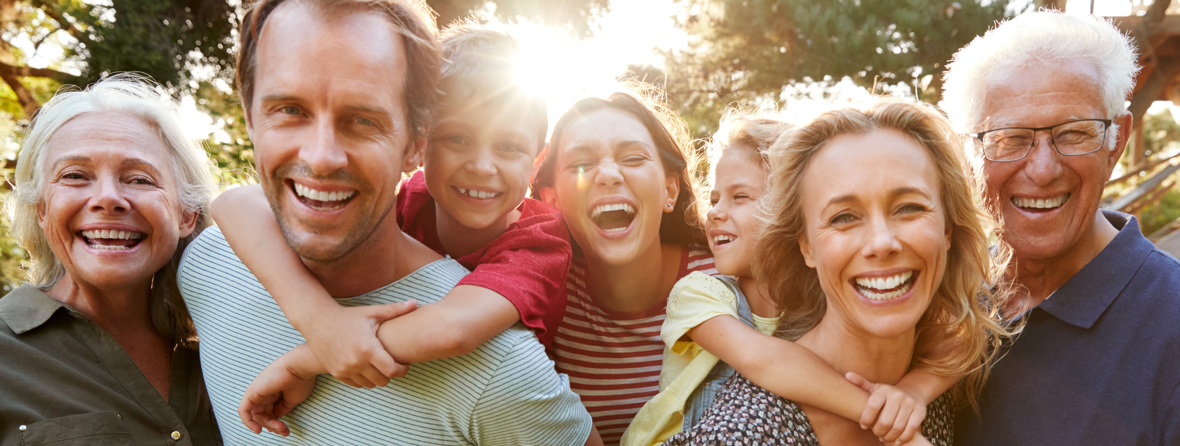 Multi-generational family gathered together outdoors
