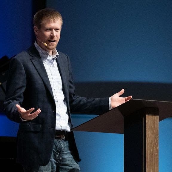 Dr. Josh Mulvihill speaking at an event