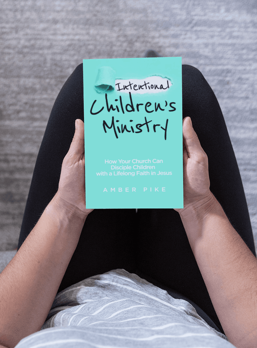 Reader holding Intentional Children's Ministry book