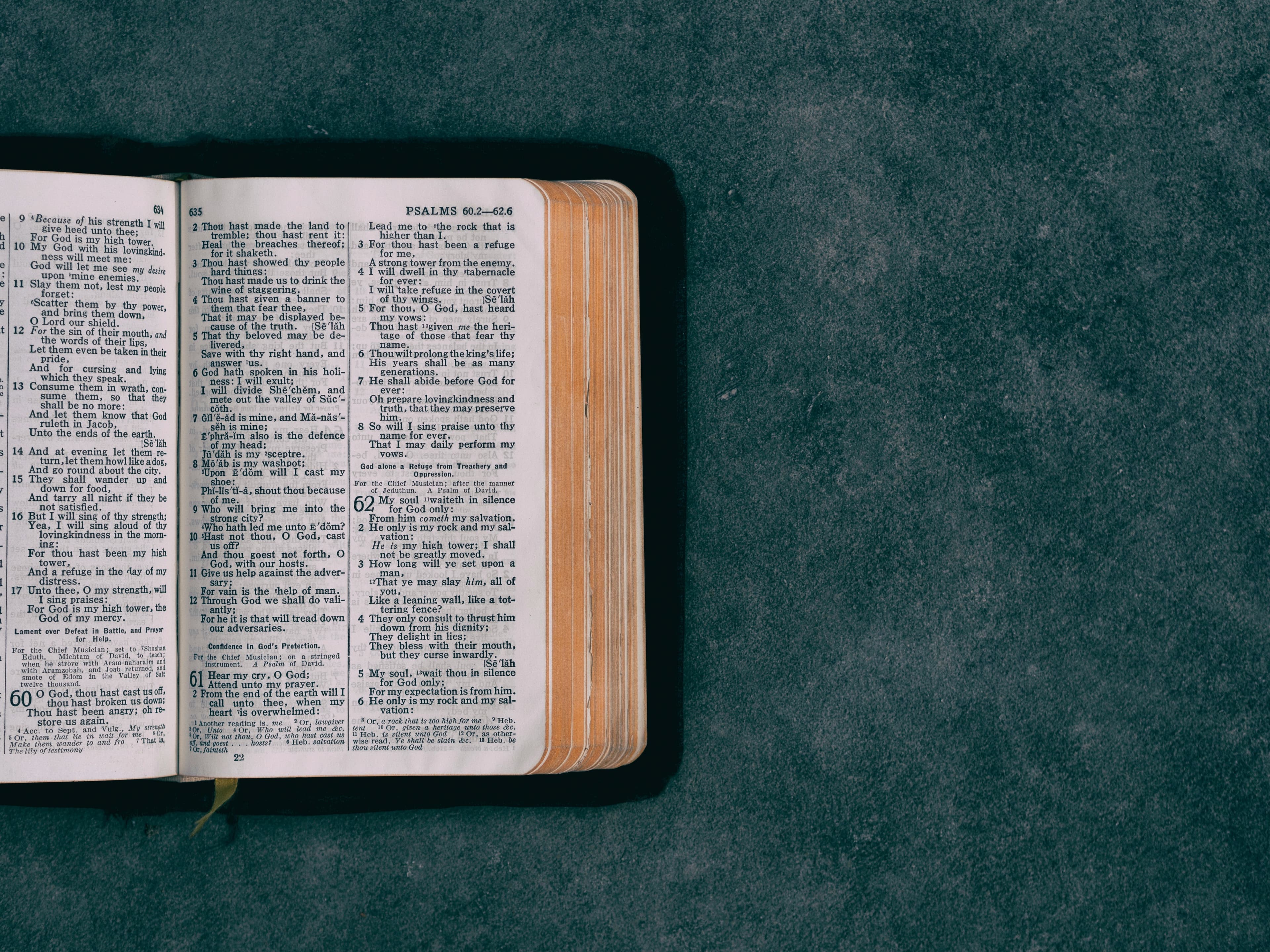 Open Bible on a dark surface